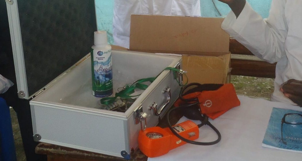 A volunteer's medical kit with a blood pressure monitor at a free health check